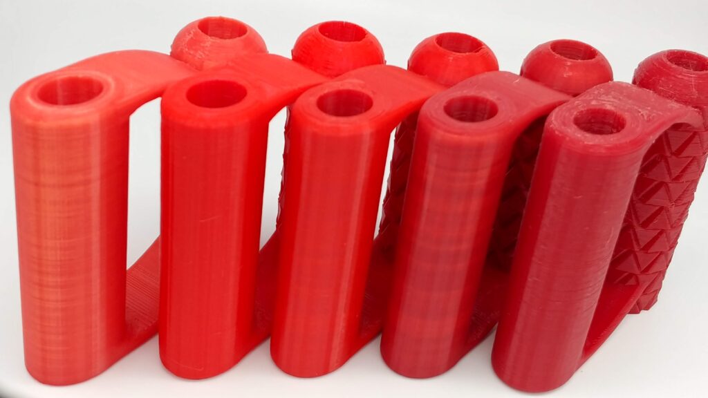 far left is discontinued next is Red PLA+, Solid Red PETG, and second to last is translucent Red PETG, and last is dark Red PETG (not listed because color is not consistent)